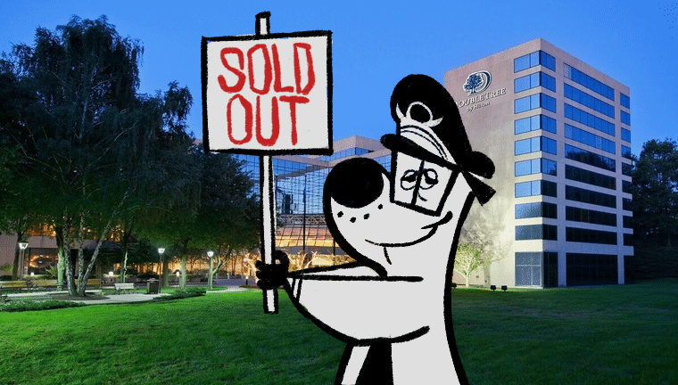 An animation of a cartoon dog holding a sign in front of the Doubletree by Hilton Stamford hotel. The sign flips between saying "Sold Out" and "Sorry".
